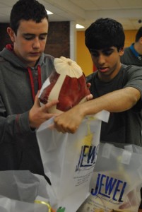 Two students from Interact Club participate in the Turkey Drive.
